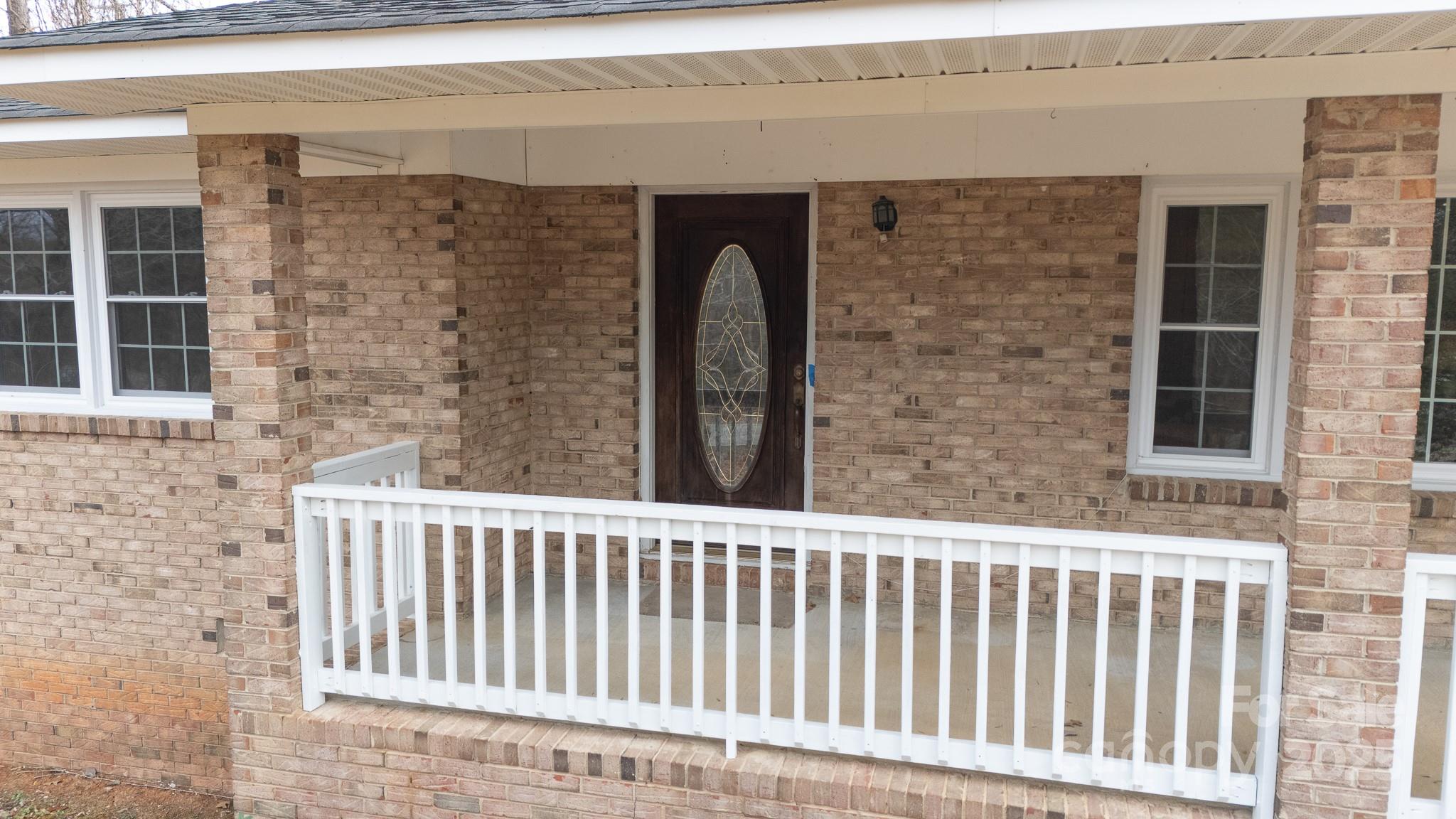 1626 Camp Creek Road Lancaster, SC 29720 - Photo 5 of 29 a view of a brick house with wooden door