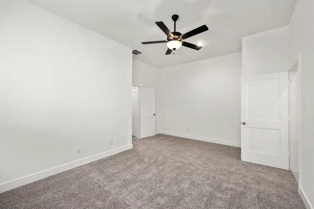 a view of a big room with carpet