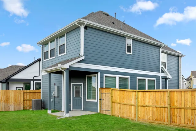 a view of house with yard