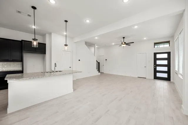 a view of a kitchen with marble kitchen and a sink