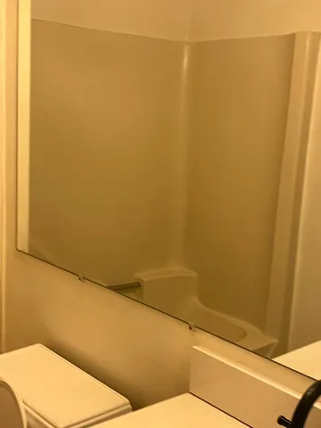 a bathroom with a toilet and a sink
