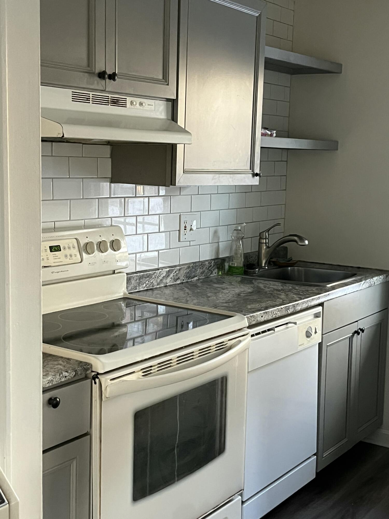 1029 Iyannough Road, Unit B BLDG 8 Hyannis, MA 02601 - Photo 7 of 14 a view of a kitchen with stove top oven