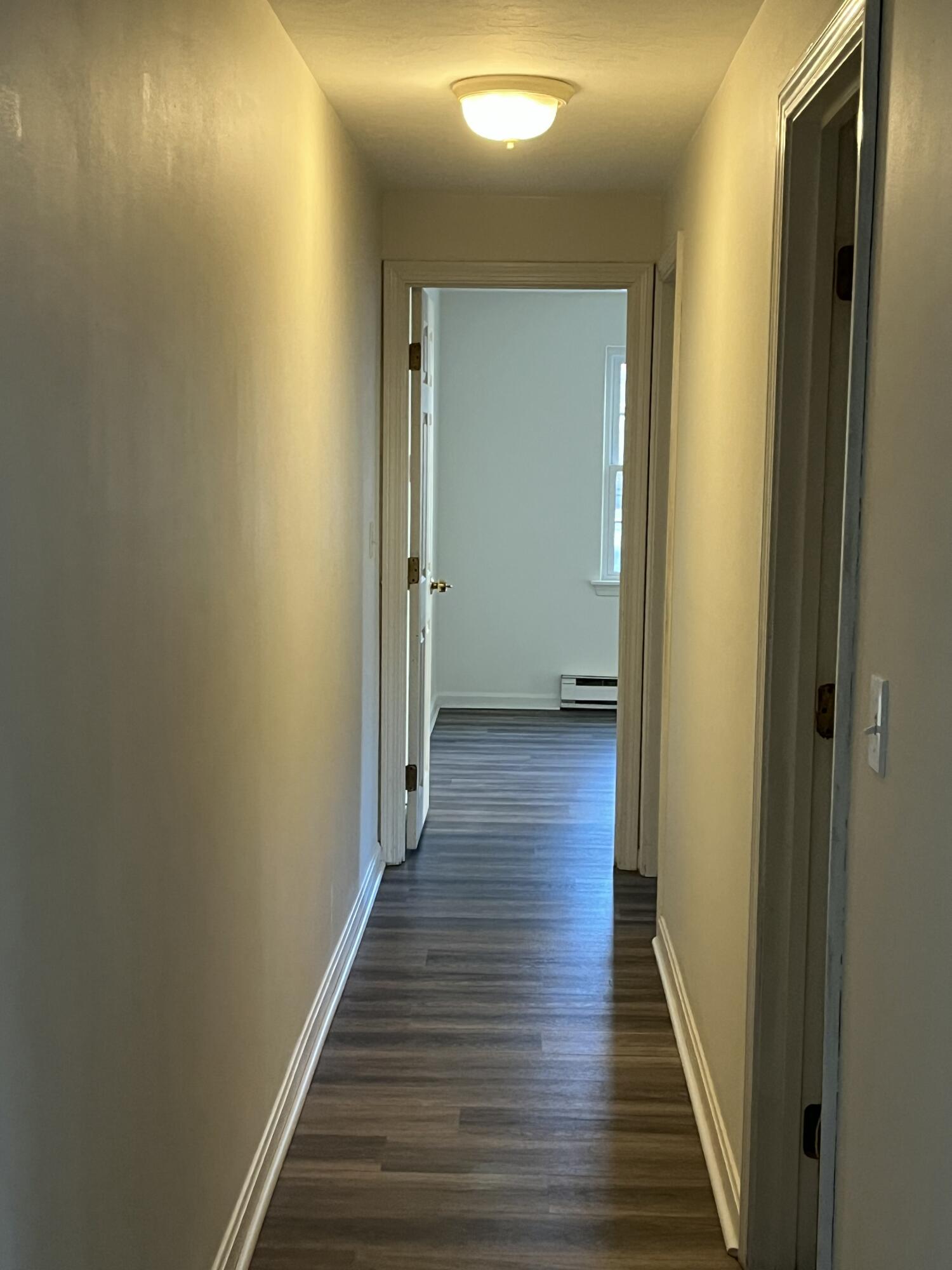 1029 Iyannough Road, Unit B BLDG 8 Hyannis, MA 02601 - Photo 8 of 13 a view of a hallway with wooden floor