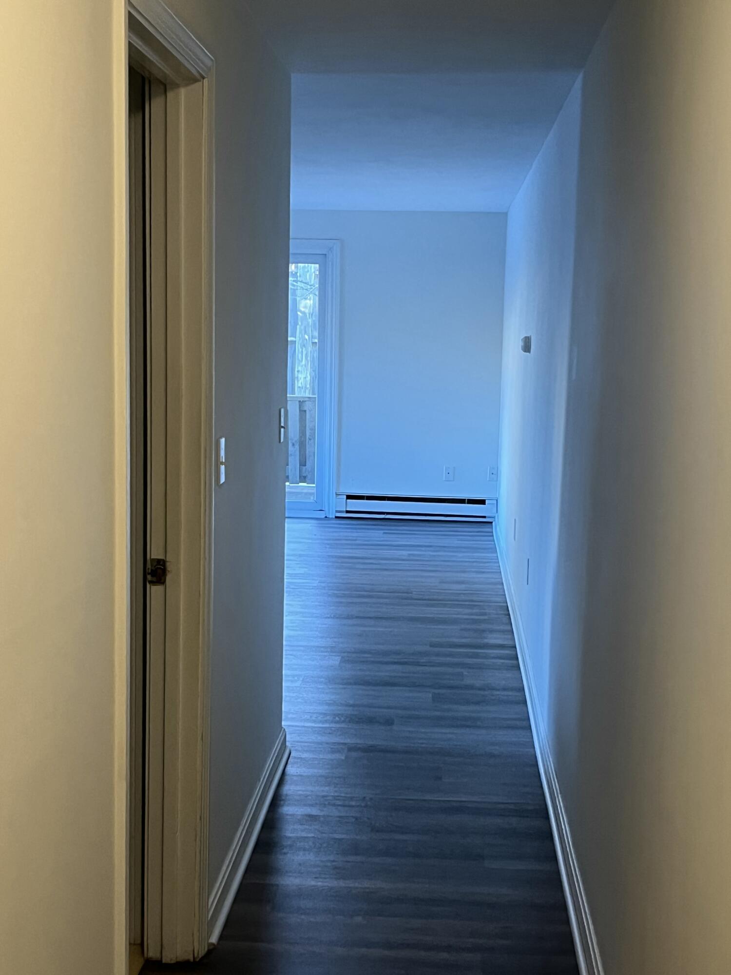 1029 Iyannough Road, Unit B BLDG 8 Hyannis, MA 02601 - Photo 9 of 13 a view of a hallway with wooden floor