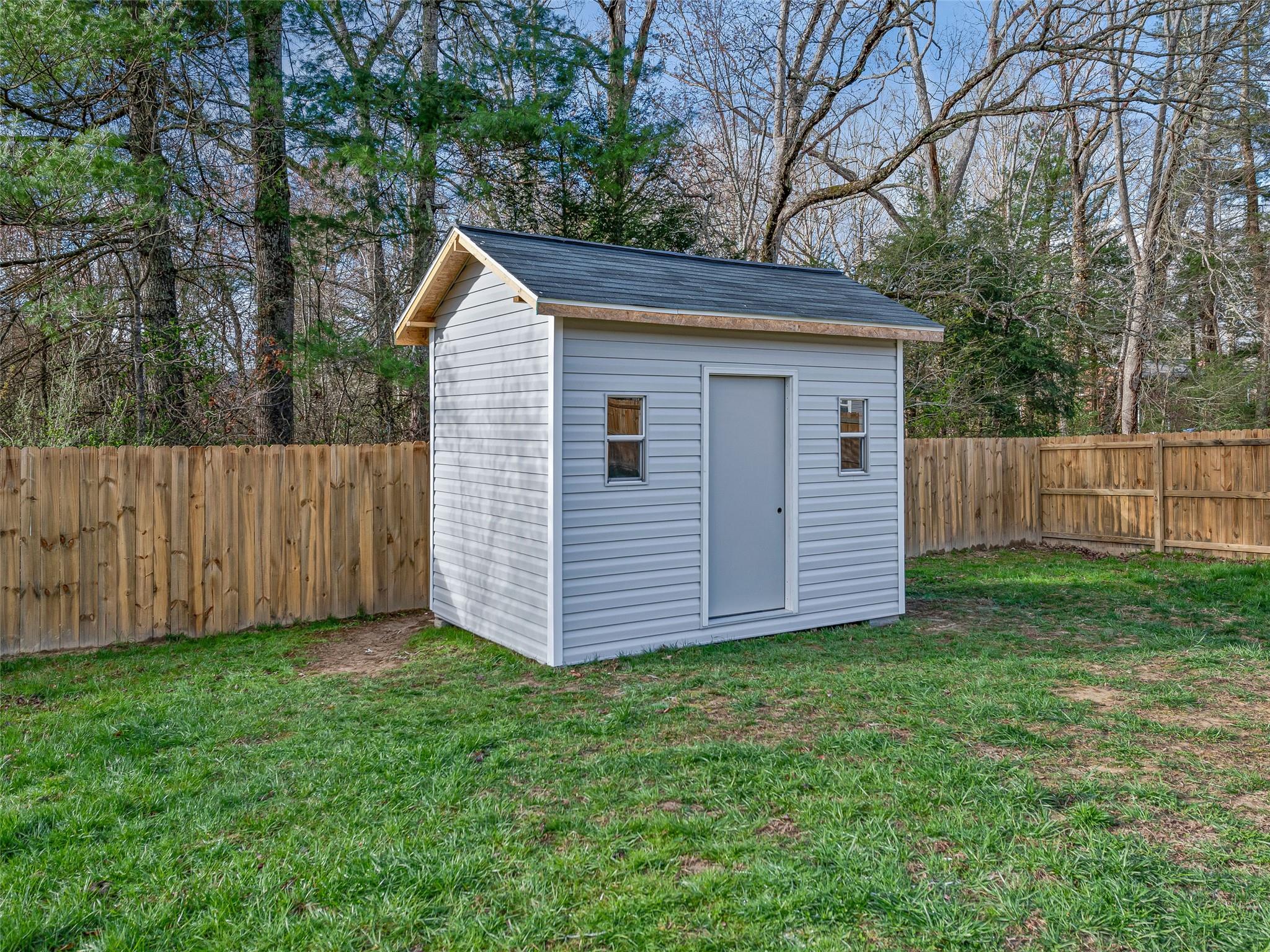 18 Souther Road Fletcher, NC 28732 - Photo 34 of 35 a view of a house with a yard and wooden fence