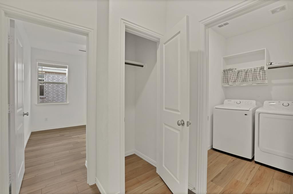 3204 Renaissance Drive Denton, TX 76207 - Photo 17 of 25 Dedicated laundry area featuring a built-in shelf and hanging rod