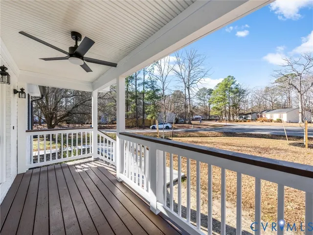 a view of a balcony with wooden floor