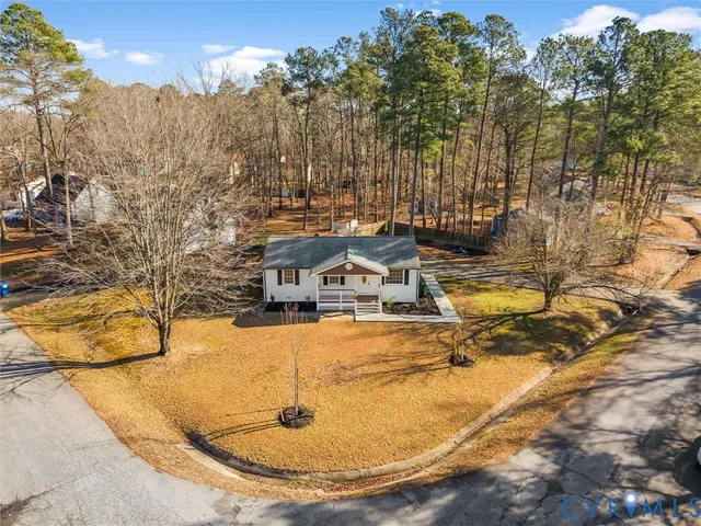 a view of a swimming pool with an outdoor seating