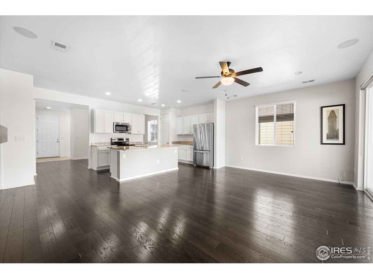 1604 Sorenson Drive Windsor, CO 80550 - Photo 16 of 32 a view of kitchen with cabinets and wooden floor