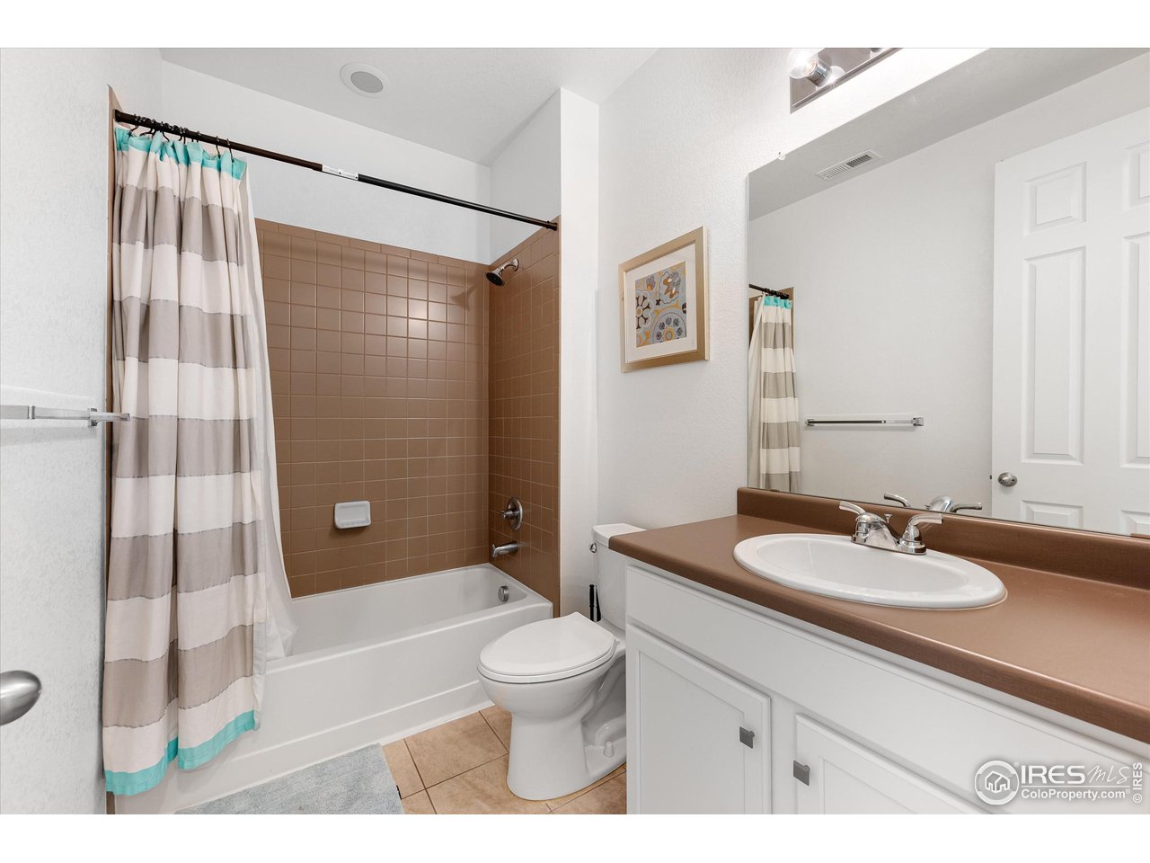 1604 Sorenson Drive Windsor, CO 80550 - Photo 22 of 32 a bathroom with a sink a toilet and shower