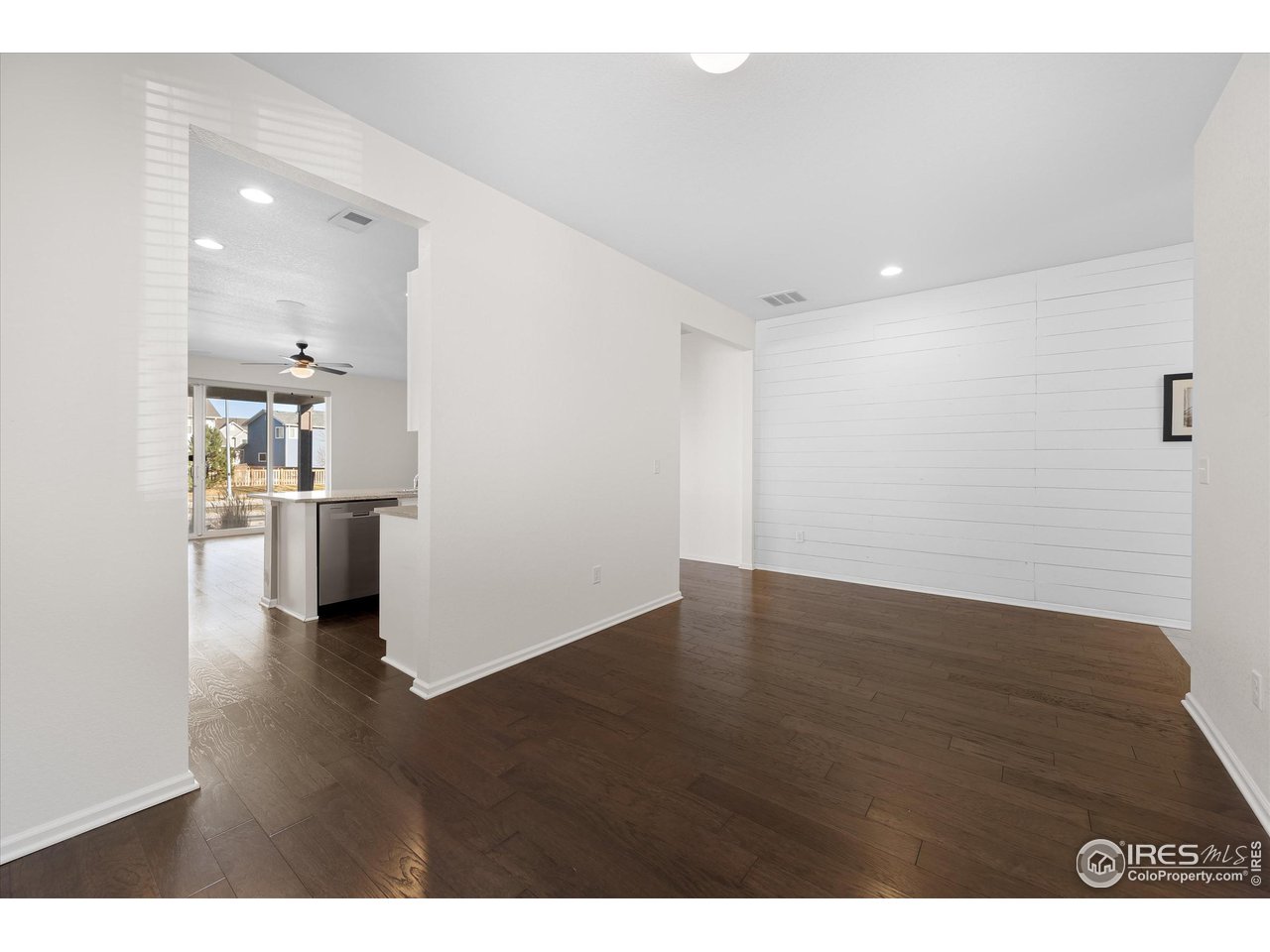 1604 Sorenson Drive Windsor, CO 80550 - Photo 5 of 32 a view of a kitchen with a refrigerator and a sink