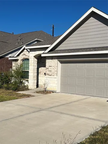 a front view of a house with a garage