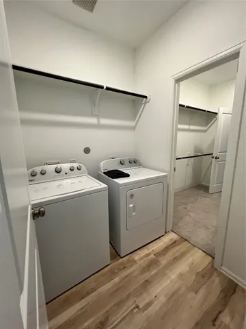 a bathroom with a double vanity sink and mirror