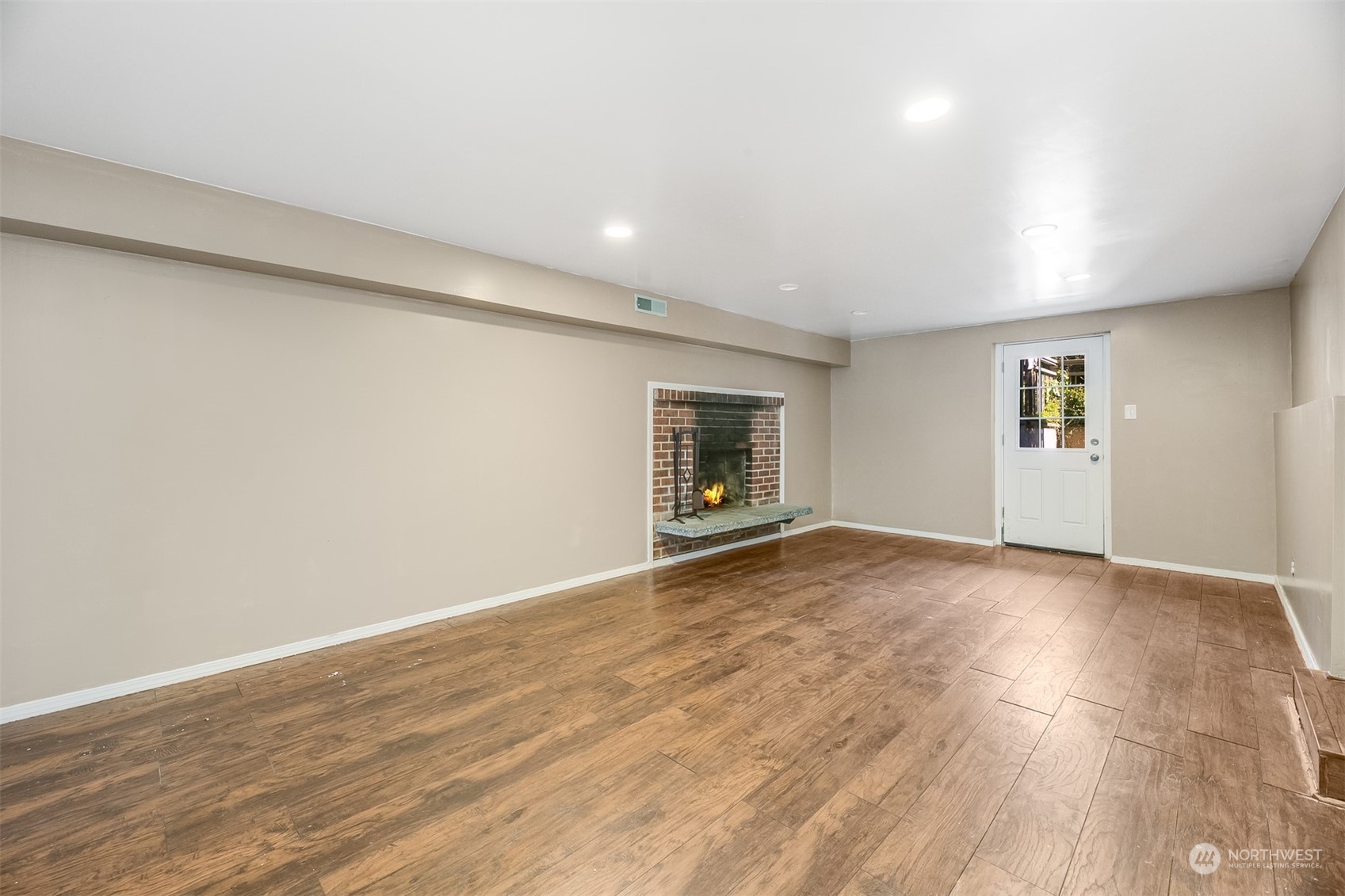 2528 Southwest 112th Street Seattle, WA 98146 - Photo 14 of 33 a view of an empty room with wooden floor and a window