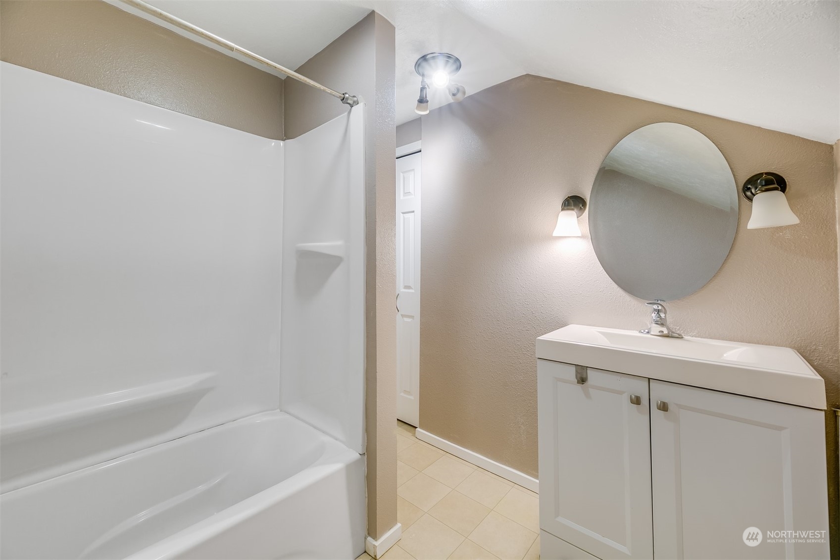 2528 Southwest 112th Street Seattle, WA 98146 - Photo 15 of 33 a bathroom with a sink a toilet and bathtub