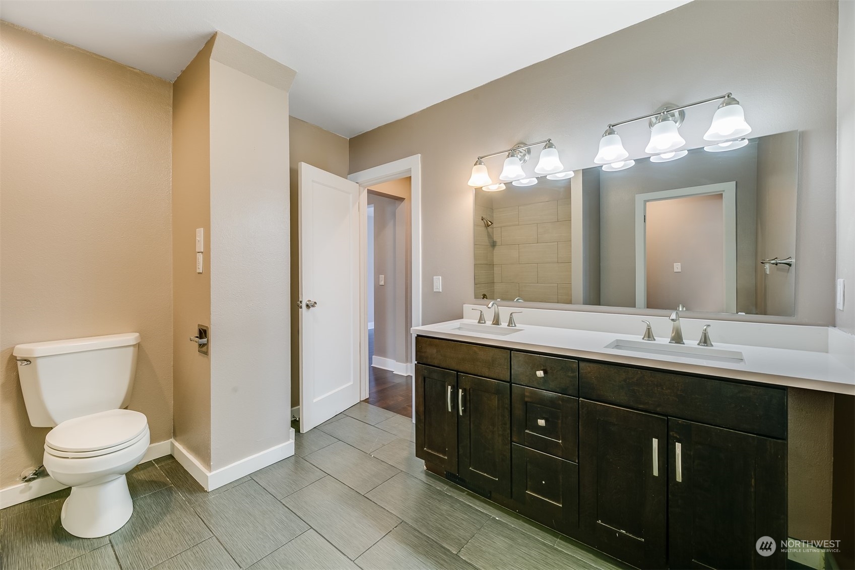 2528 Southwest 112th Street Seattle, WA 98146 - Photo 23 of 33 a bathroom with a toilet sink and mirror