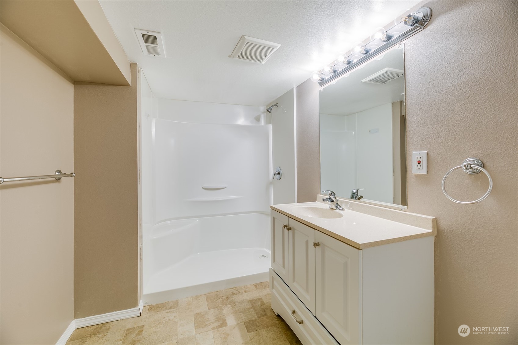 2528 Southwest 112th Street Seattle, WA 98146 - Photo 24 of 33 a bathroom with a sink mirror and vanity