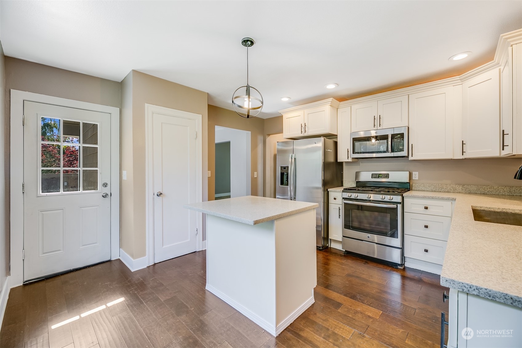 2528 Southwest 112th Street Seattle, WA 98146 - Photo 3 of 33 a kitchen with stainless steel appliances granite countertop a stove oven and a refrigerator