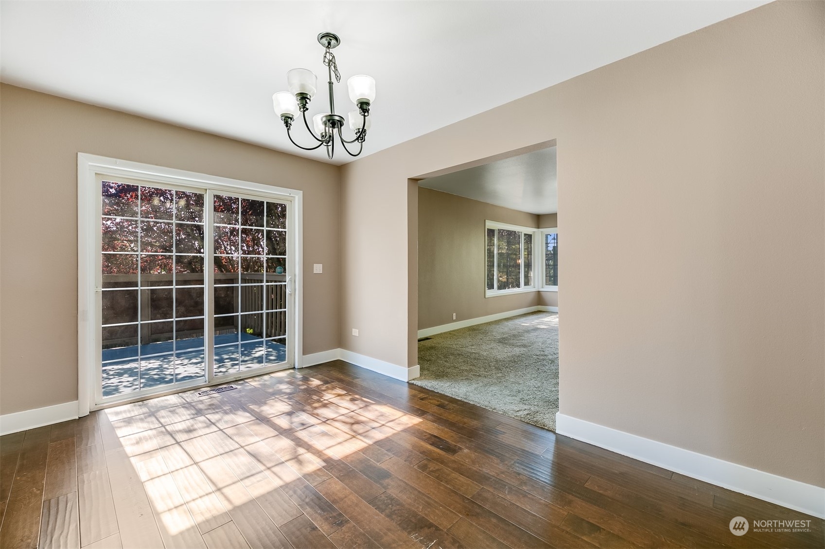 2528 Southwest 112th Street Seattle, WA 98146 - Photo 6 of 33 a view of an empty room with wooden floor