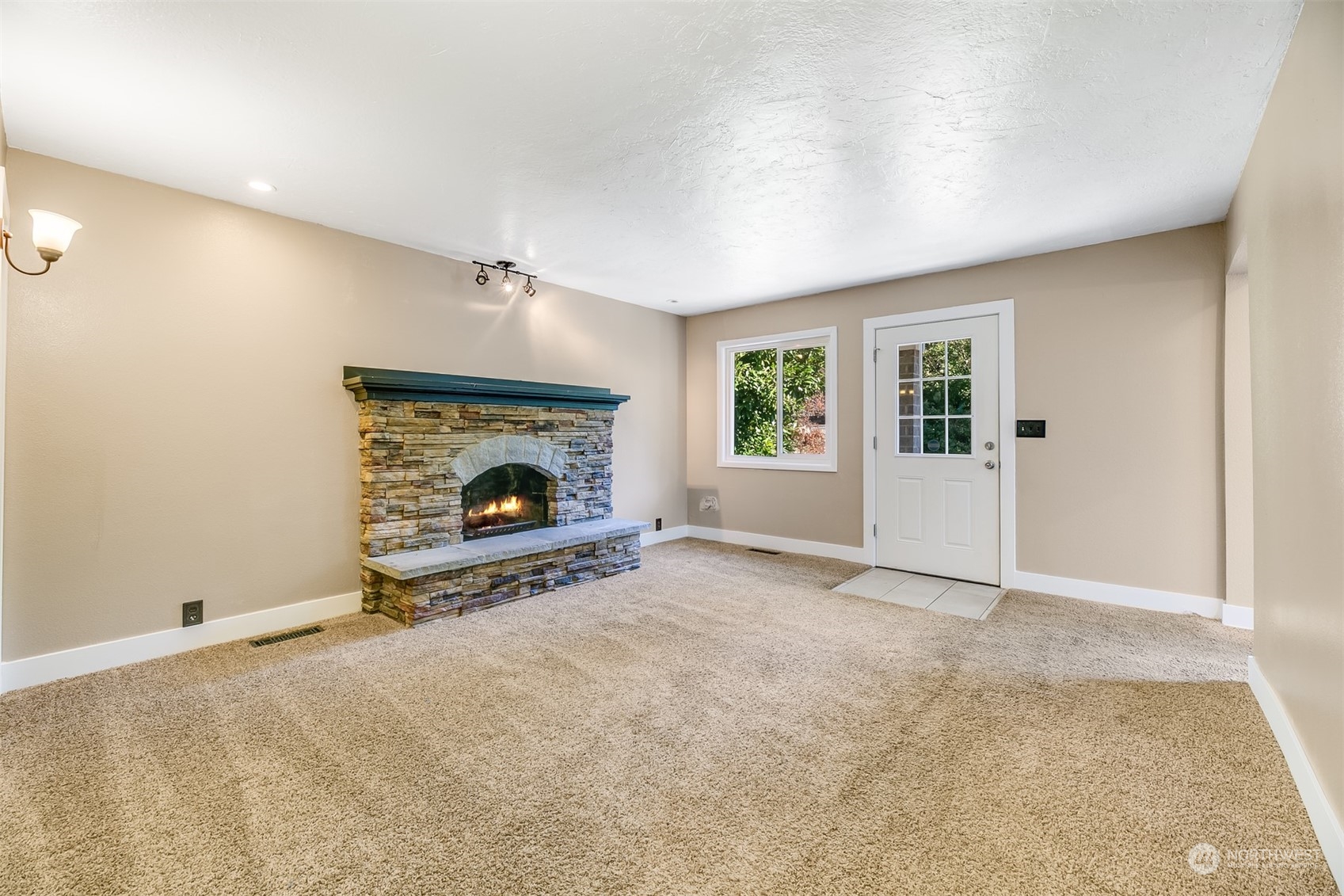 2528 Southwest 112th Street Seattle, WA 98146 - Photo 8 of 33 an empty room with fireplace and windows
