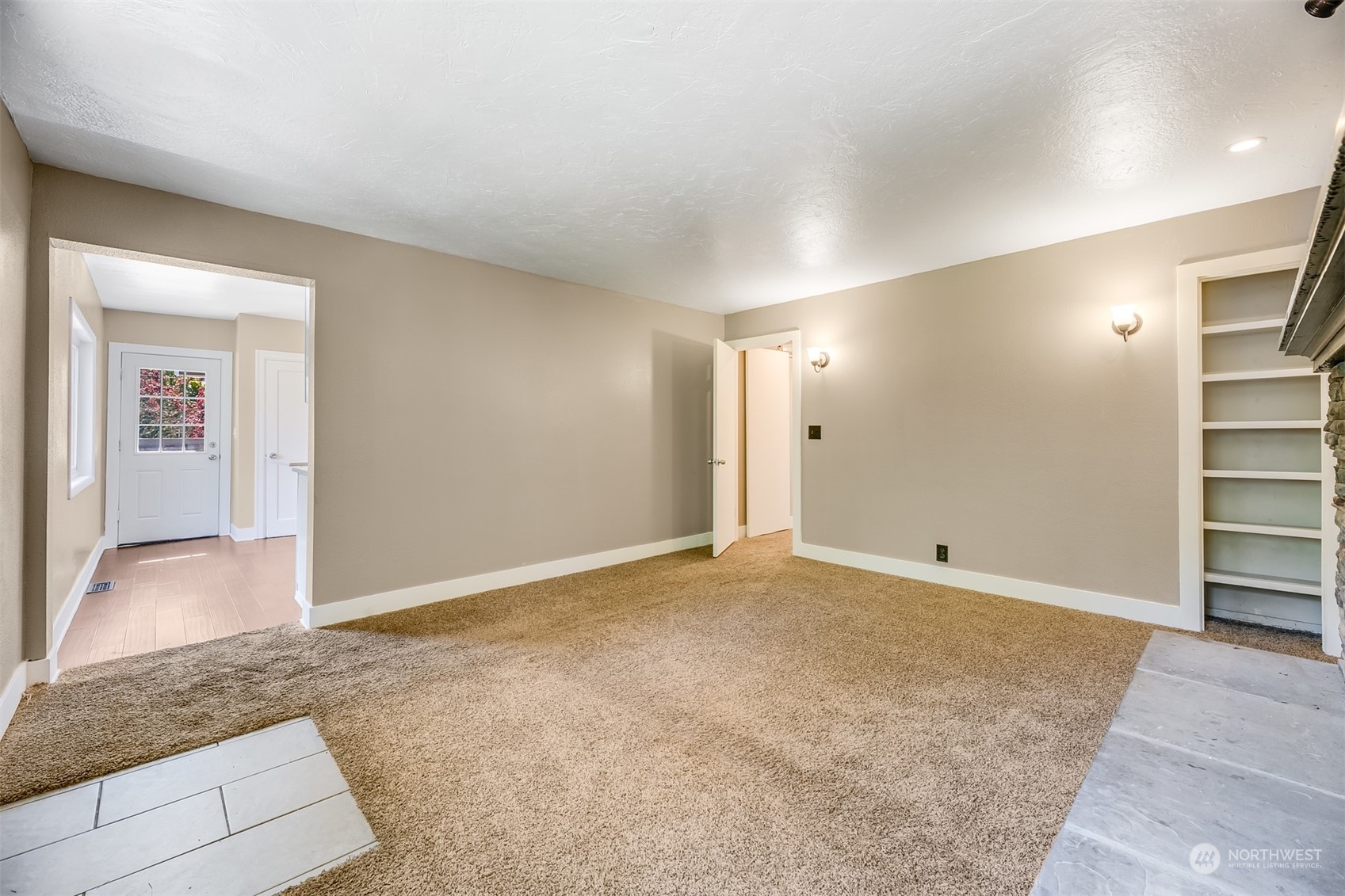2528 Southwest 112th Street Seattle, WA 98146 - Photo 9 of 33 an empty room with cabinet and mirrors