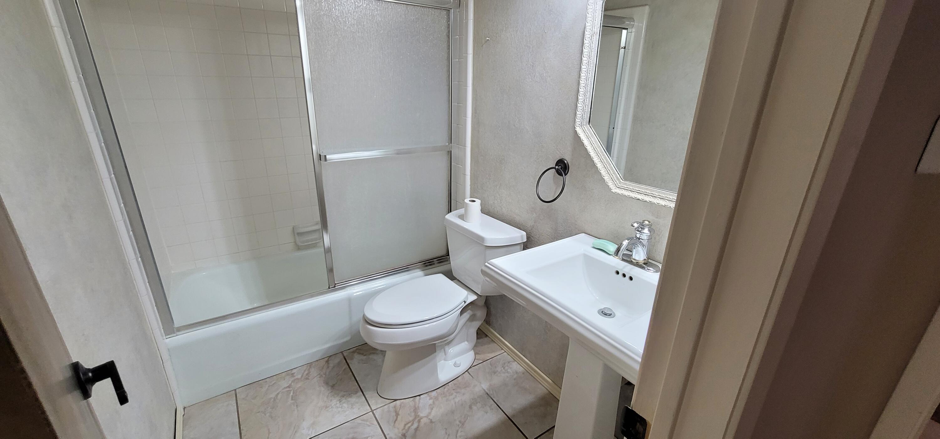 4803 73rd Street Lubbock, TX 79424 - Photo 26 of 32 The guest bath is clean and neat!