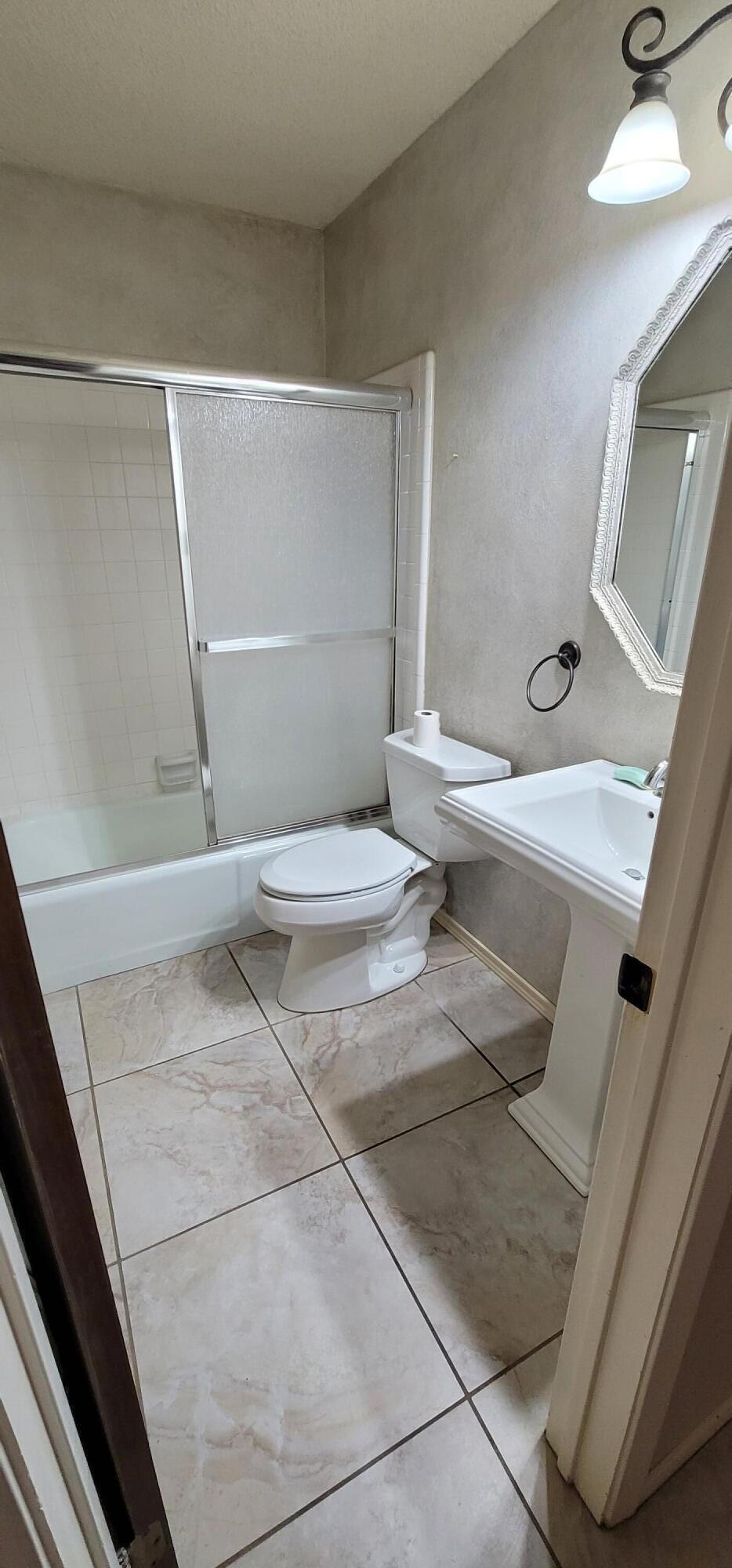 4803 73rd Street Lubbock, TX 79424 - Photo 27 of 32 It features a pedestal sink