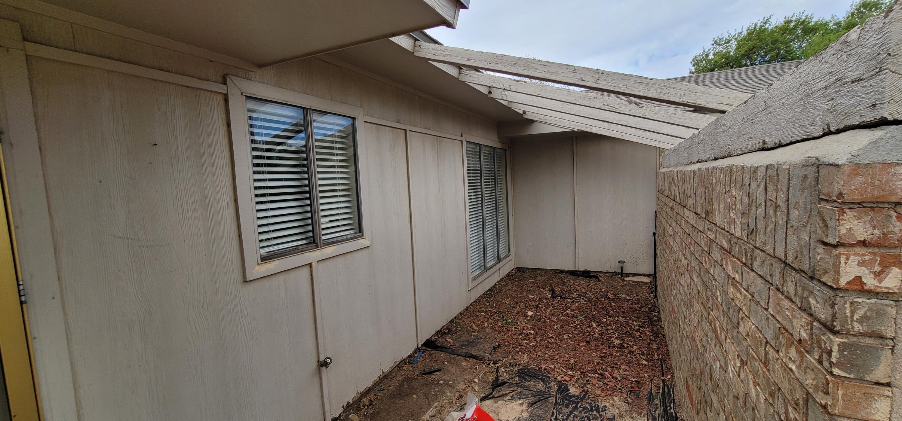 4803 73rd Street Lubbock, TX 79424 - Photo 4 of 32 Privacy Courtyard greets your arrival!