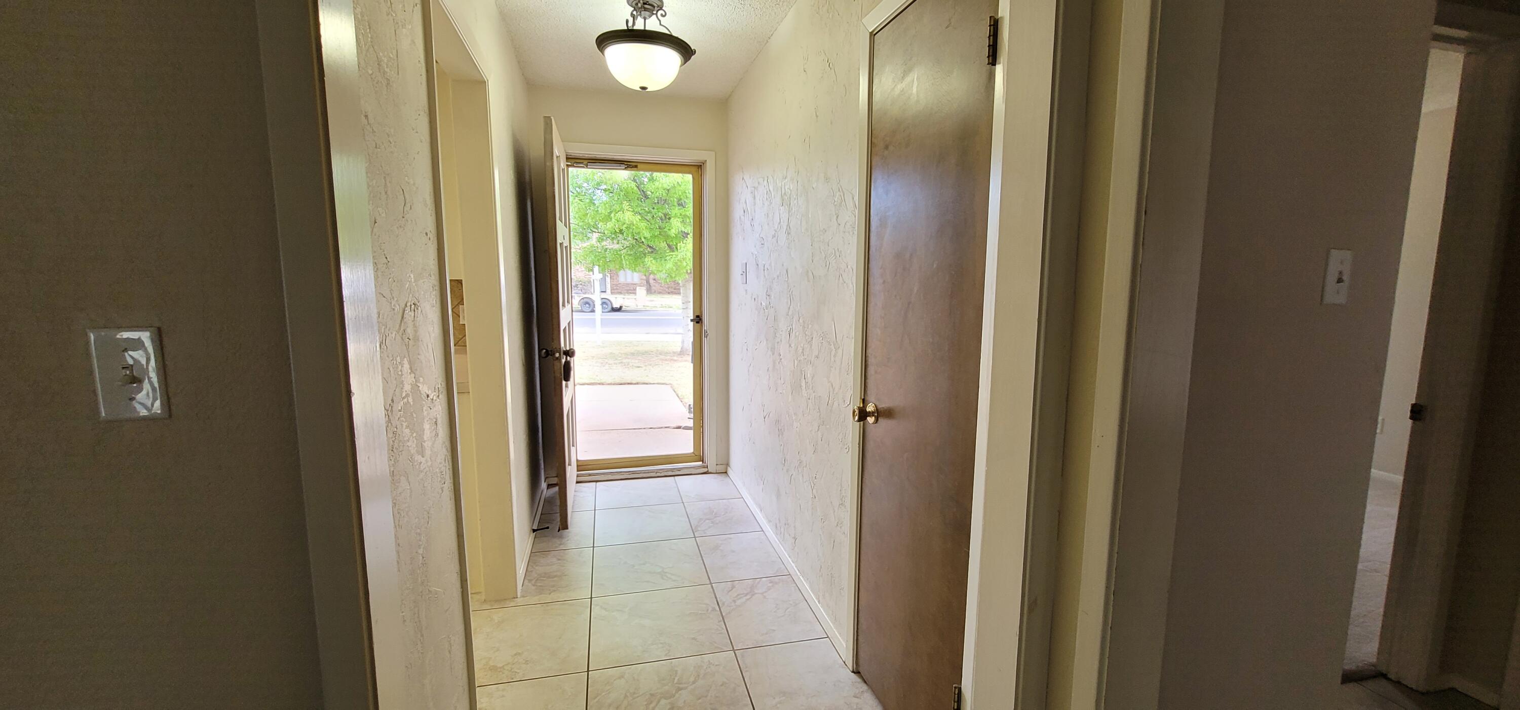 4803 73rd Street Lubbock, TX 79424 - Photo 5 of 32 Step into modern tile & texture!