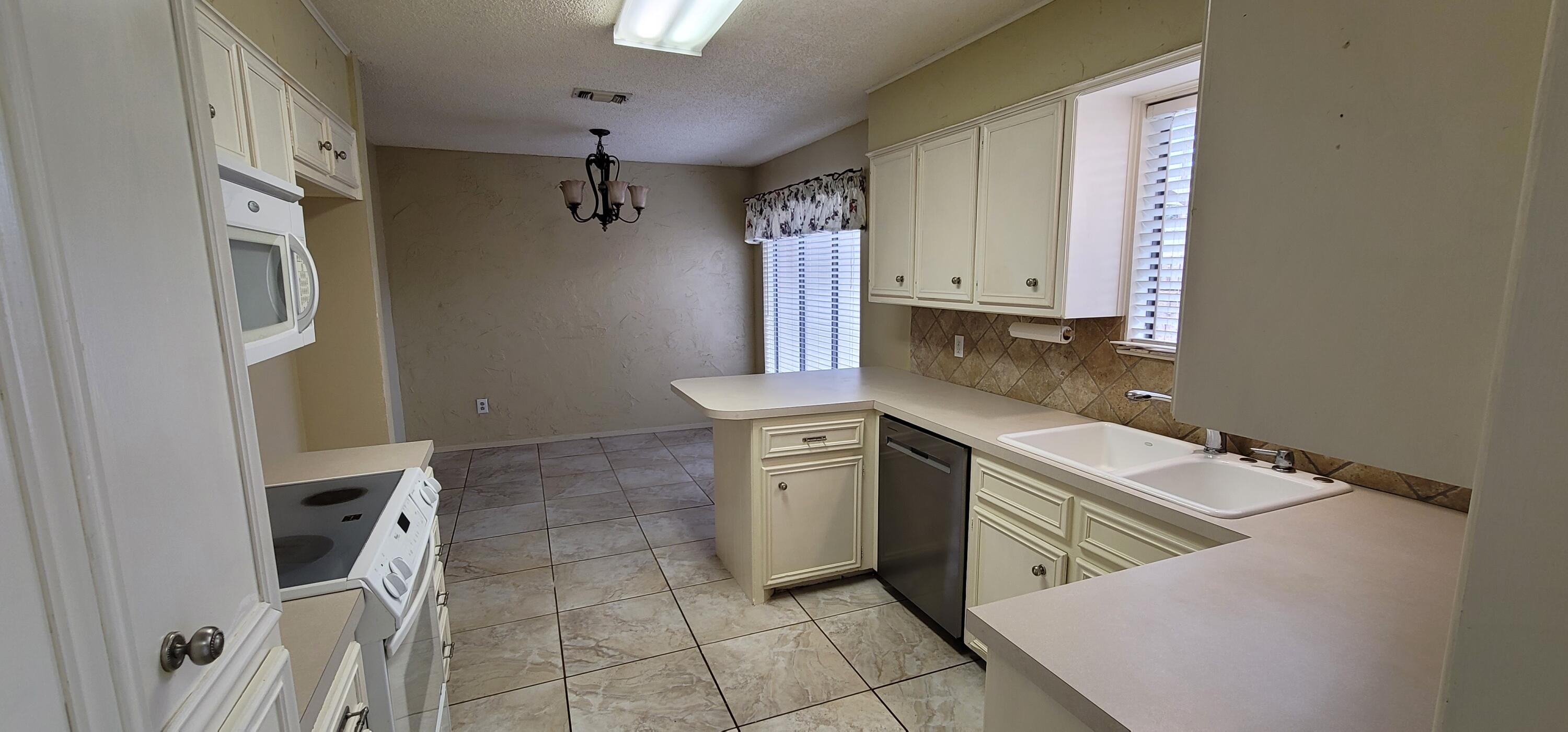 4803 73rd Street Lubbock, TX 79424 - Photo 6 of 32 The front kitchen is filled with Light!