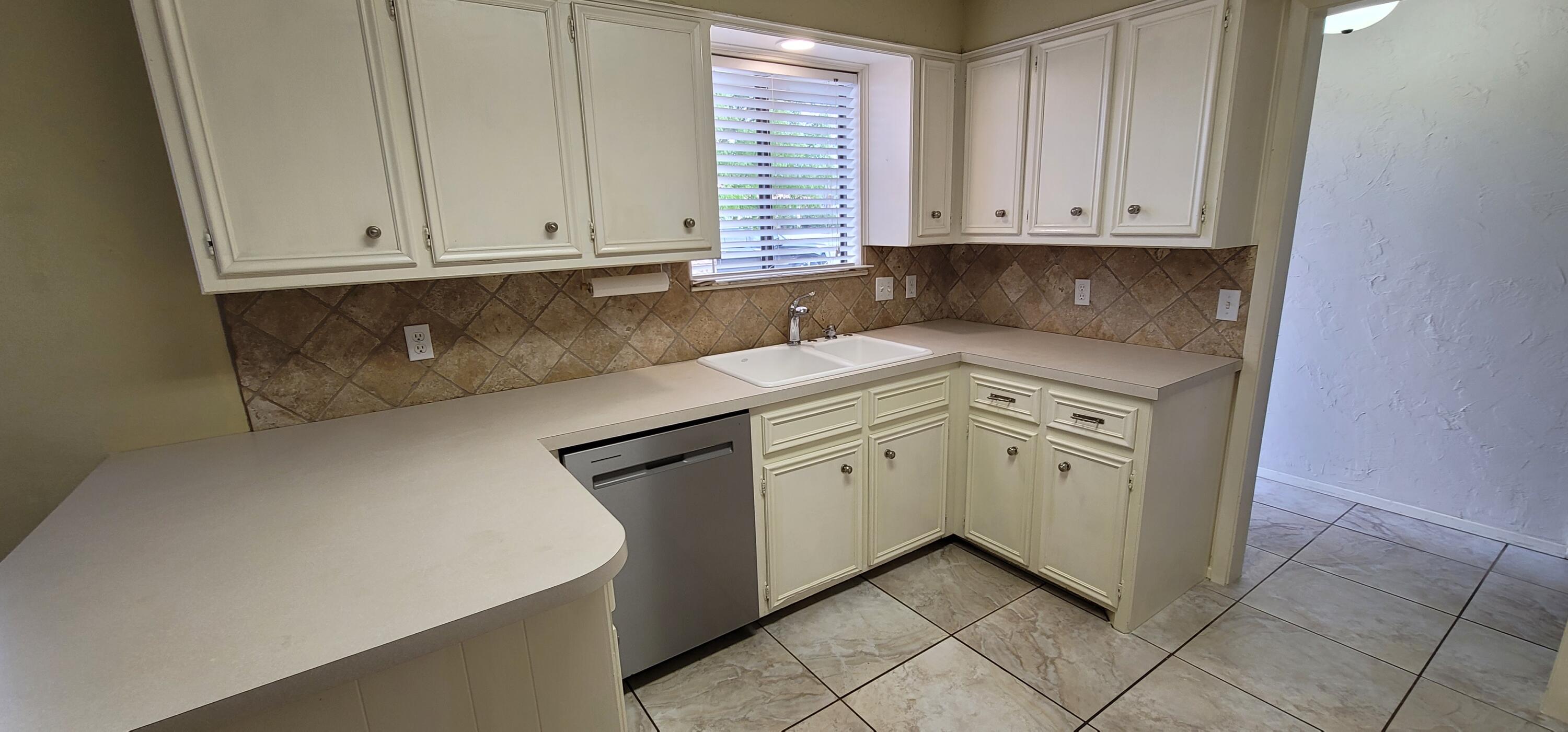 4803 73rd Street Lubbock, TX 79424 - Photo 8 of 32 Tiled Backsplash & Painted Cabinets