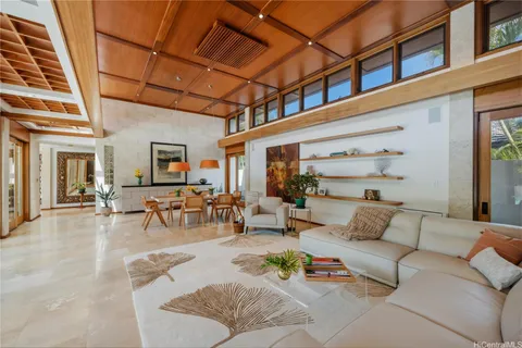 a view of a patio with couches and potted plants