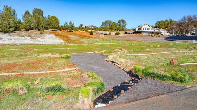a view of a town with trees in the background