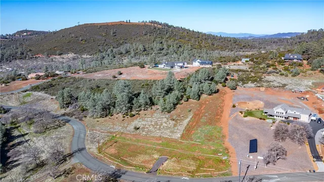 an aerial view of a house with outdoor space
