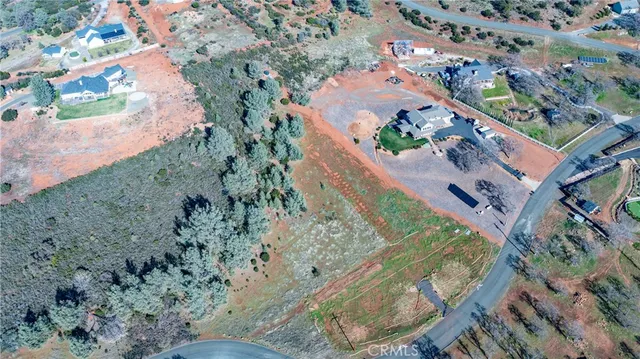 an aerial view of residential house and green space
