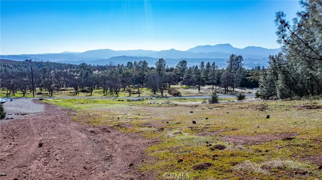 a view of a town with mountains in the background