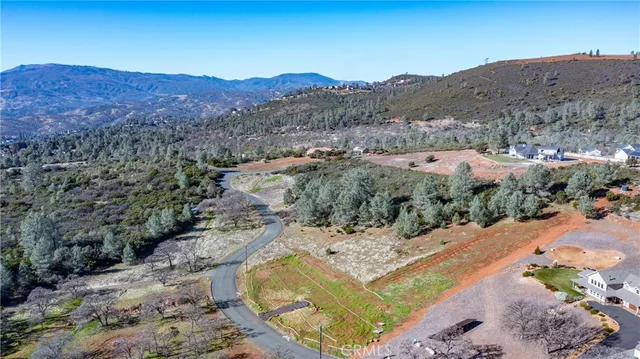 an aerial view of residential house and sandy dunes