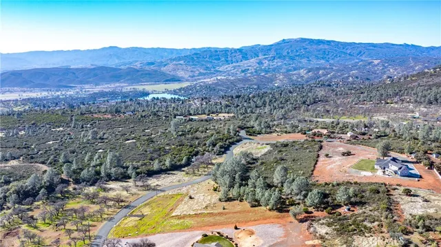 an aerial view of residential houses and outdoor space