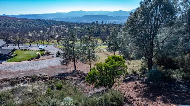a view of a town with mountains in the background