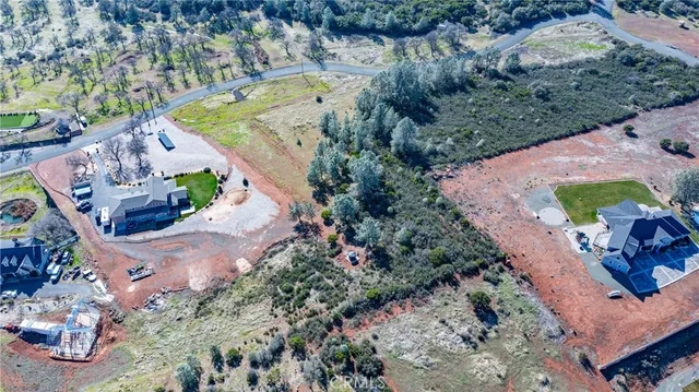 a view of a town with trees in the background