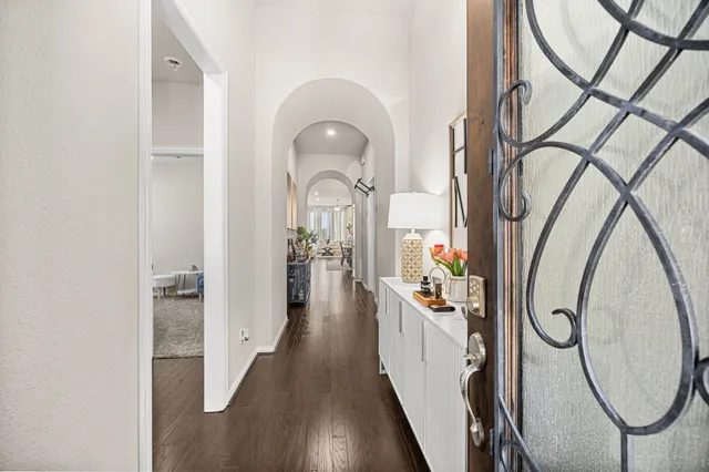 a view of a entryway door with wooden floor