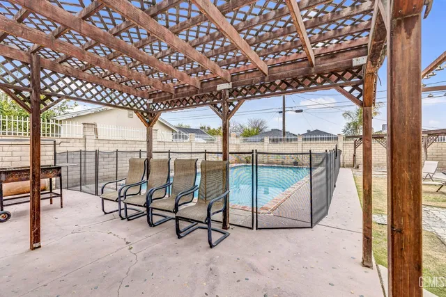 a view of a porch with furniture and garden view