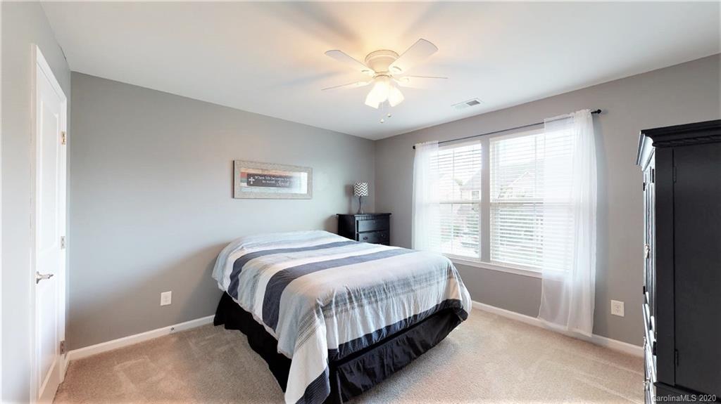 3012 Fallondale Road Waxhaw, NC 28173 - Photo 40 of 47 a bedroom with a large bed and a window