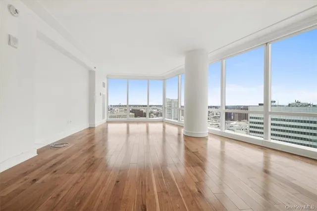 a view of open kitchen with wooden floor and electronic appliances