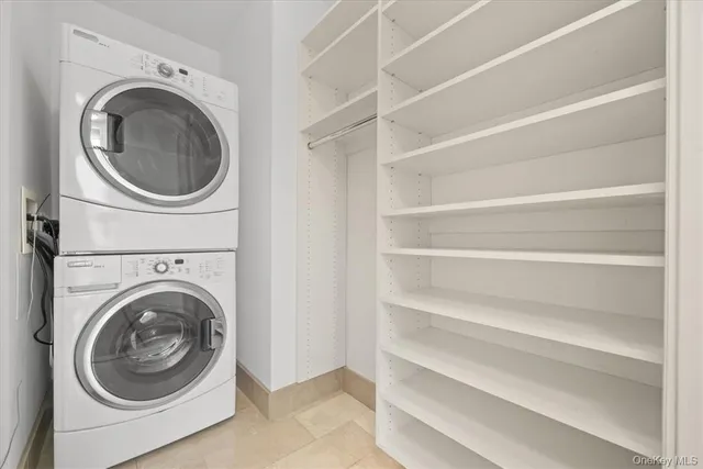 a utility room with washing machine and a washer dryer