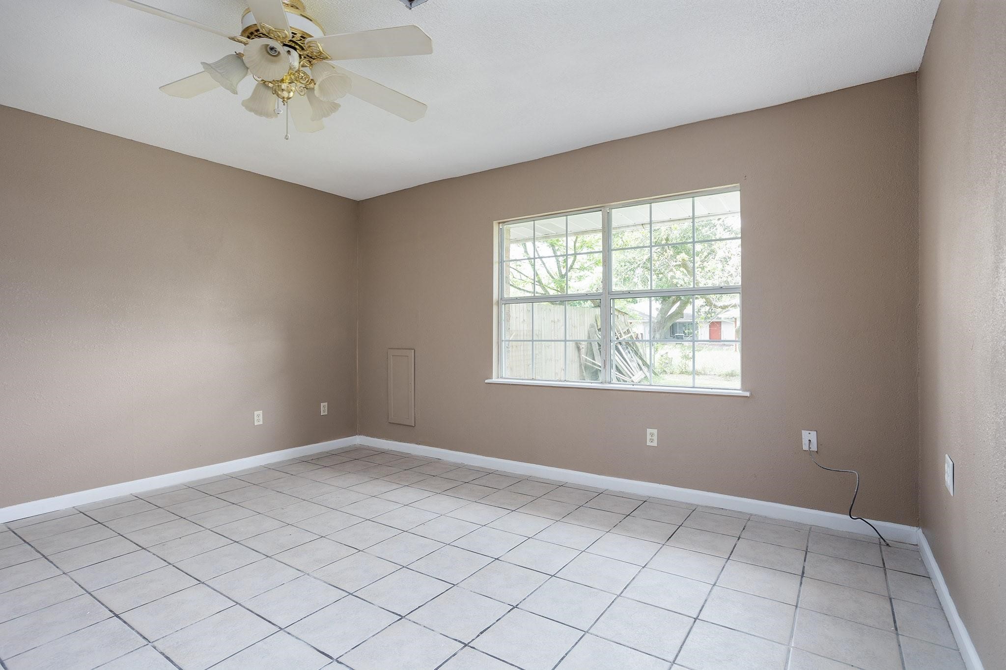 2538 Oday Road, Unit A Pearland, TX 77581 - Photo 3 of 8 a view of an empty room with a window