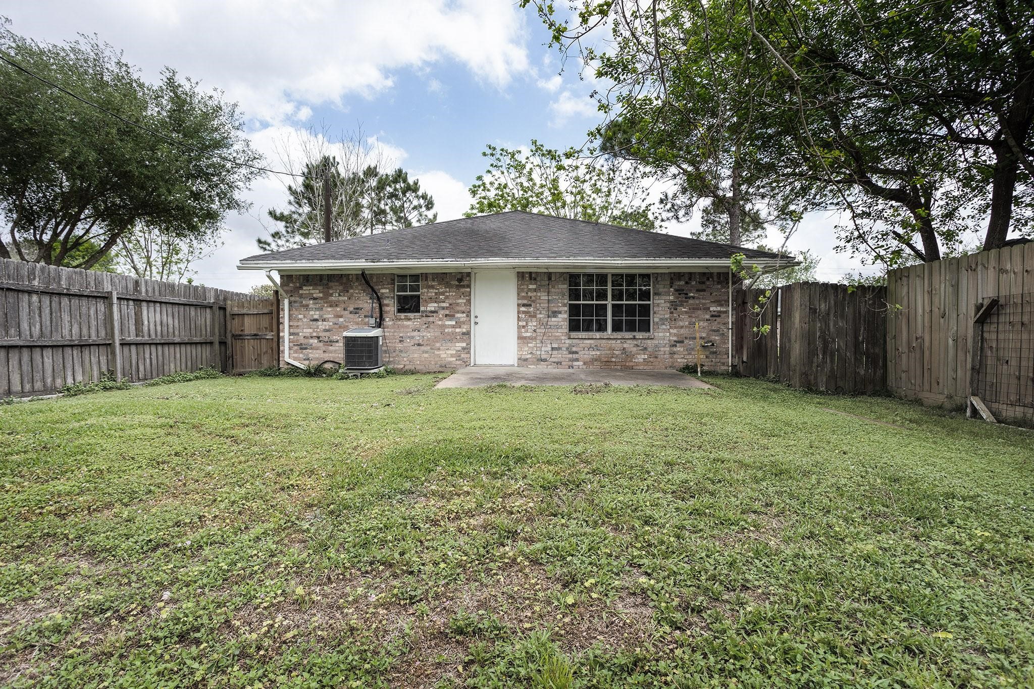 2538 Oday Road, Unit A Pearland, TX 77581 - Photo 7 of 8 a front view of house with yard and green space