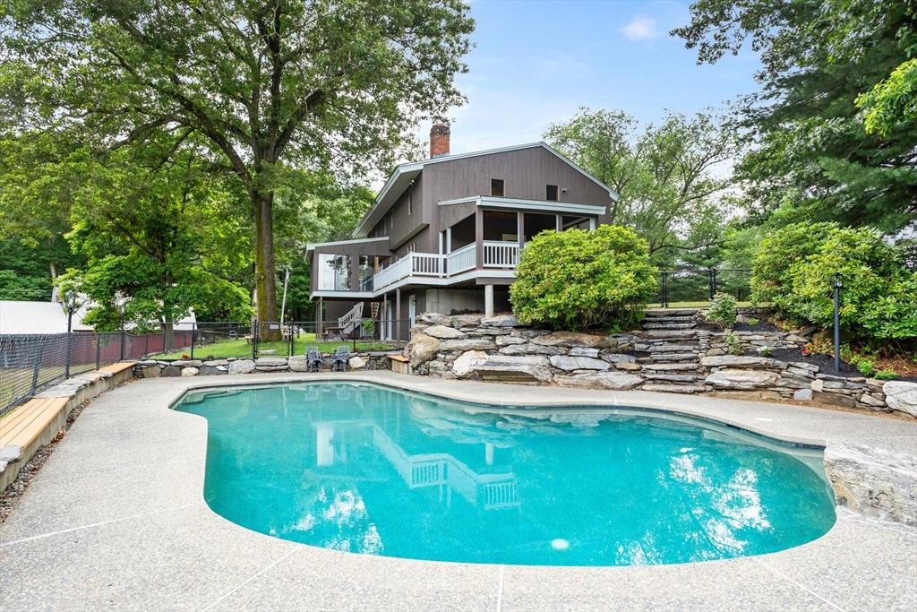 292 Berlin Road Bolton, MA 01740 - Photo 1 of 42 a view of a house with swimming pool and sitting area