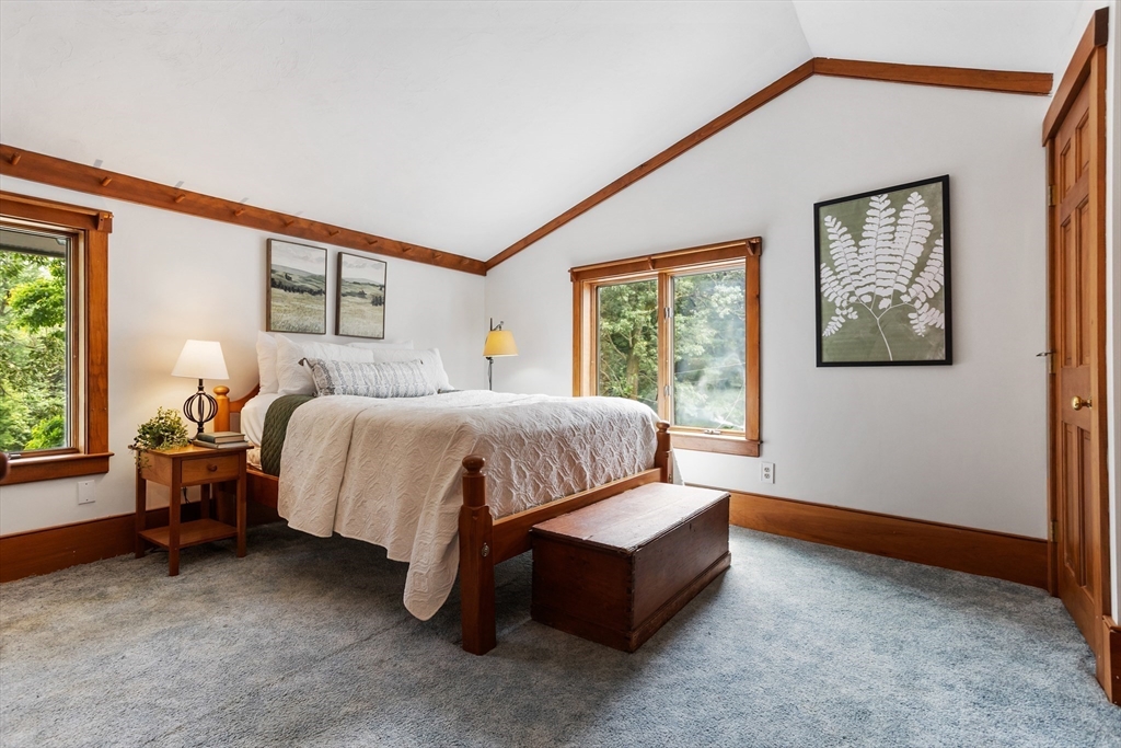292 Berlin Road Bolton, MA 01740 - Photo 21 of 42 a bedroom with a bed mirror and window