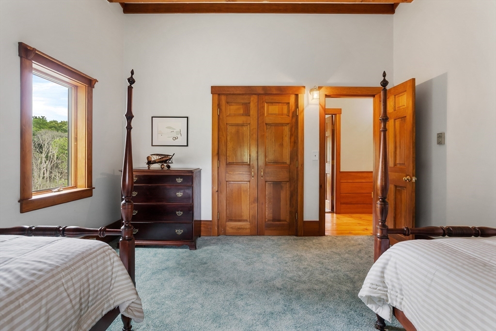 292 Berlin Road Bolton, MA 01740 - Photo 27 of 42 a bedroom with a bed and a window